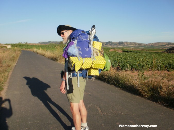 Dennis carrying two packs