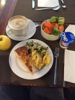 Power brunch at the hotel. Scrambled eggs, tortilla, zucchini, fresh fruit, cafe con leche.