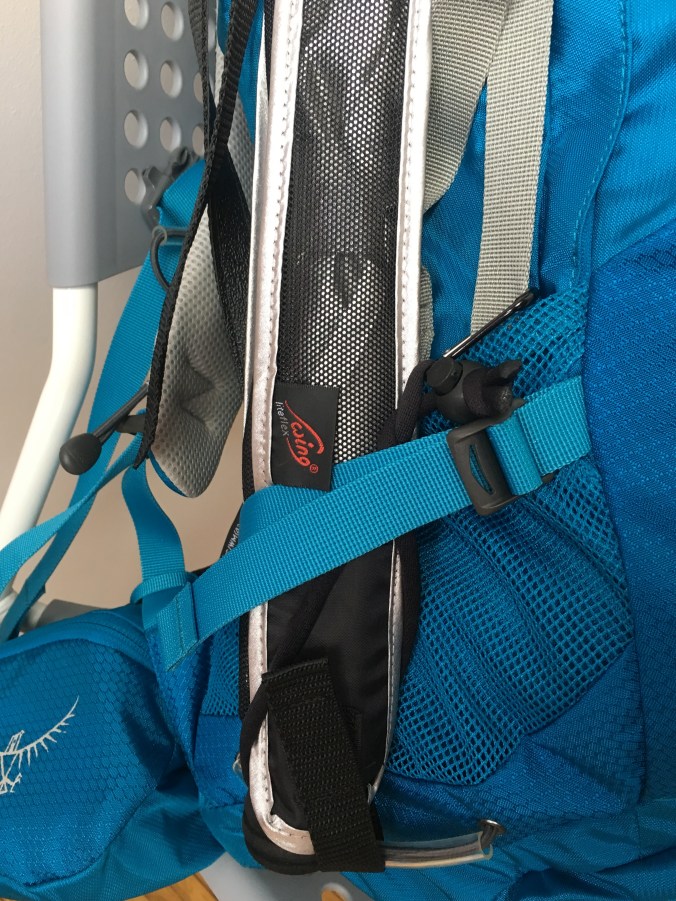 I used the the velcro of the umbrella case, and the strap, along with a carbiner hook to secure it to the straps of my backpack.