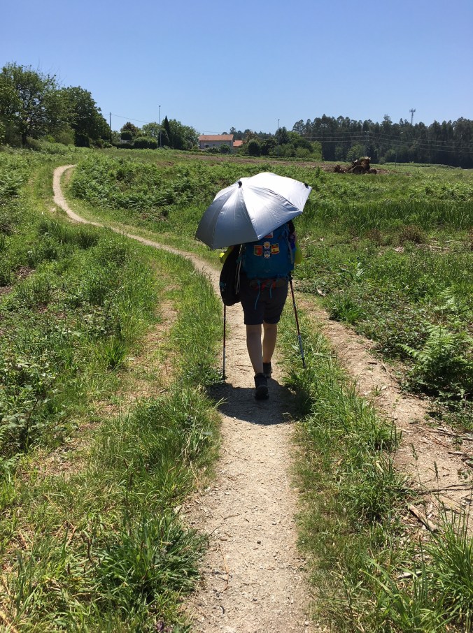 Walking under the shade of my umbrella