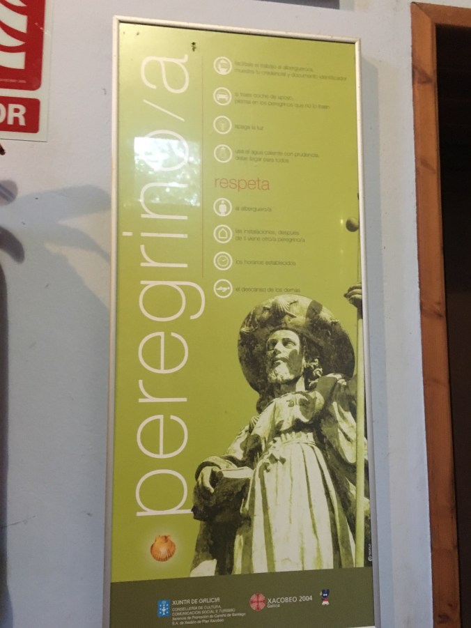 A poster in the dining area with basic rules for pilgrims